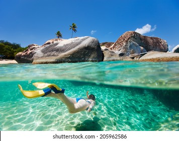 Split Photo Of Young Woman Snorkeling In Turquoise Tropical Water Among Huge Granite Boulders At The Baths Beach Area Major Tourist Attraction On Virgin Gorda, British Virgin Islands, Caribbean