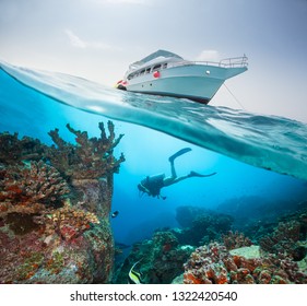 Split Photography Of Safari Yacht And Woman Diver Exploring Coral Reef. Underwater Fauna, Flora And Marine Life.