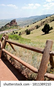 Split rail fence by trail in Red Rocks Park near the Red Rock Amphitheater in Morrison, Colorado. Red Rocks Park is a mountain park in Jefferson County, owned and maintained by the city of Denver. 