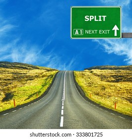 SPLIT Road Sign Against Clear Blue Sky