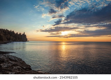 Split Rock lighthouse on the north shore of Lake Superior at dawn with dramatic clouds and light during autumn