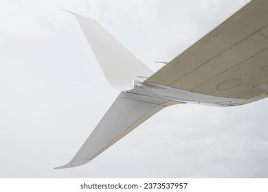 Split scimitar winglets with the lower part angled downwards to reduce the aircraft's drag by partially recovering the energy generated by the wing tip vortex even further than normal winglets. 