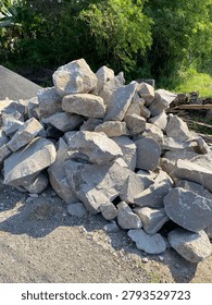 Split stone for house foundation construction, providing a strong and stable base for residential buildings.
