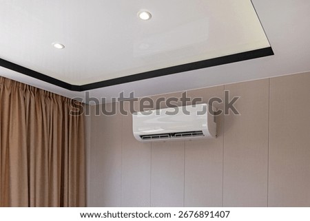 Split System Air Conditioner Mounted at Wall in Living Room Home