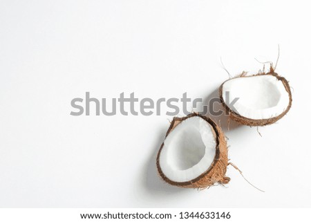 Split tropical coconut isolated on white background