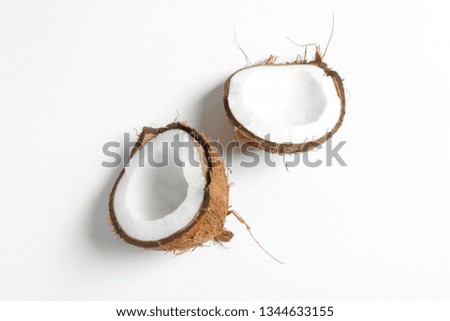 Split tropical coconut isolated on white background