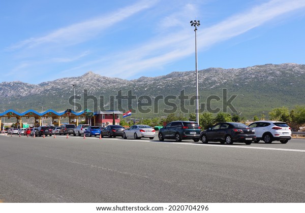 Split,Croatia,06.08.2021. Convoys\
of cars at the exit from the highway in Split, traffic jams in the\
tourist\
season
