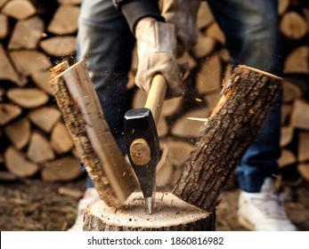 Splitting of a firewood with an ax, close up - Powered by Shutterstock