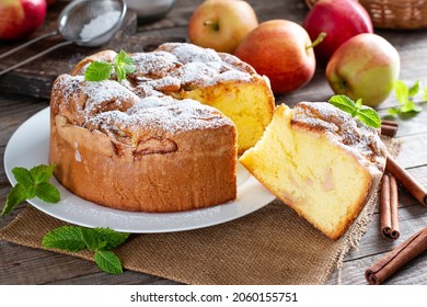 Sponge cake or chiffon cake with apples, so soft and delicious with ingredients: eggs, flour, apples on wooden table. Homemade bakery concept for background and wallpaper. - Shutterstock ID 2060155751