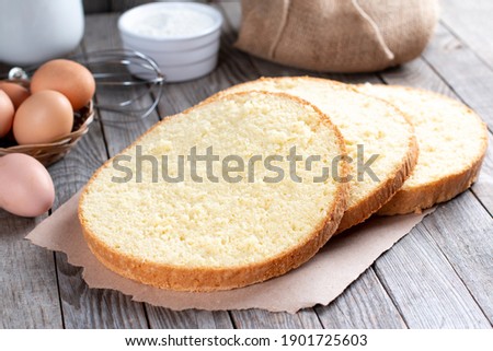 Sponge cake or chiffon cake, so soft and delicious with ingredients: eggs, flour, milk on wood table. Homemade bakery concept for background and wallpaper.