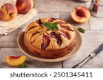 Sponge cake with peaches and brown sugar. Delicious homemade sweet pie with seasonal fruits. 