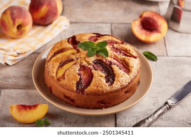 Sponge cake with peaches and brown sugar. Delicious homemade sweet pie with seasonal fruits.  - Powered by Shutterstock