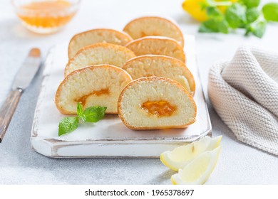 Sponge Cake Roll With Lemon Jam Sliced Into Pieces, Selective Focus