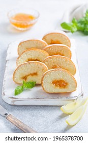 Sponge Cake Roll With Lemon Jam Sliced Into Pieces, Selective Focus