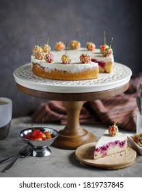 Sponge Cake With Sour Cream And Sweet Cherry In Pastry Topping. High Wooden Stand.