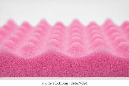 Sponge cushioning pink color on white background