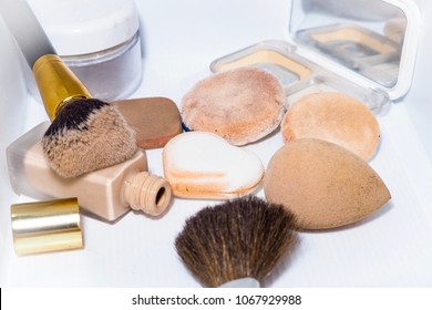 Sponge And Makeup Brushes Used To Be Old And Dirty. On A White Background Isolated