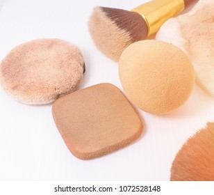 Sponge And Makeup Brushes Used To Be Old And Dirty. On A White Background Isolated.