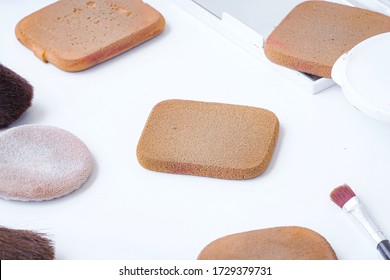 
Sponge And Makeup Brushes Used To Be Old And Dirty. On A White Background Isolated