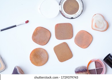 
Sponge And Makeup Brushes Used To Be Old And Dirty. On A White Background Isolated