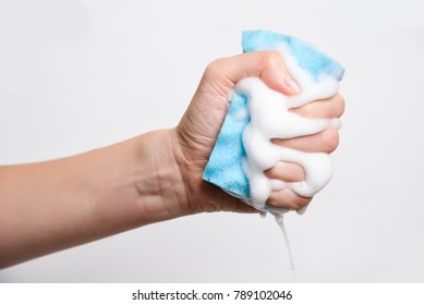 Sponge for washing dishes in hand - Shutterstock ID 789102046