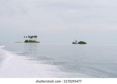 Spongebob Island (Manimbora Island) view from speedboat, leaving from island, borneo, Indonesia