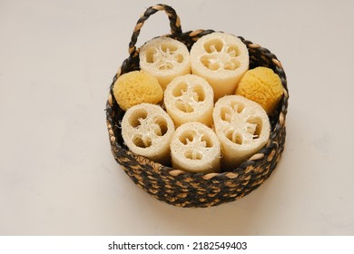  Sponges And Loofah Washcloths In A Wicker Basket On A Beige Background.Zero Waste Hygiene Products. Eco Friendly Bio Natural Cosmetics.reasonable Consumption