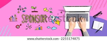 Sponsor with person using a laptop computer