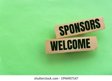 SPONSORS WELCOME on wooden blocks. Sponsorship donation support business startup concept.
