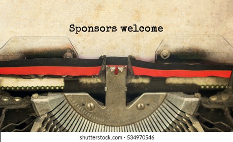 Sponsors welcome typed words on a vintage typewriter with vintage background                               