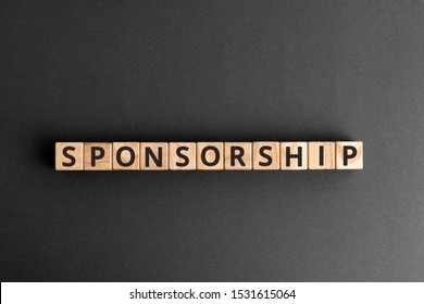 Sponsorship - word from wooden blocks with letters, financially supporting sponsoring fundraising concept,  top view on grey background
