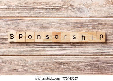 Sponsorship Word Written On Wood Block. Sponsorship Text On Table, Concept.