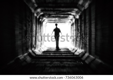 Spooky figure at the end of the dark tunnel. Life after death