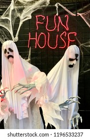 Spooky Fun Haunted House Decoration - Ghosts Next To Fun House Neon Sign