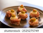 Spooky Halloween Eyeball Finger Food with Prosciutto, Mozzarella, and Green Olives - Keto Appetizer Close-Up