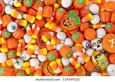 Spooky Orange Halloween Candy Against A Background