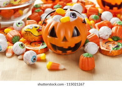 Spooky Orange Halloween Candy Against A Background