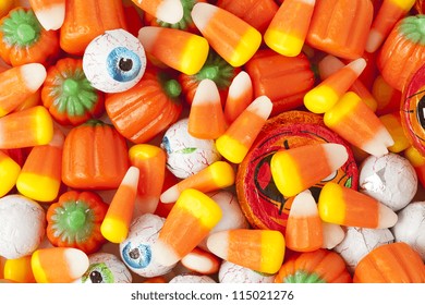 Spooky Orange Halloween Candy Against A Background