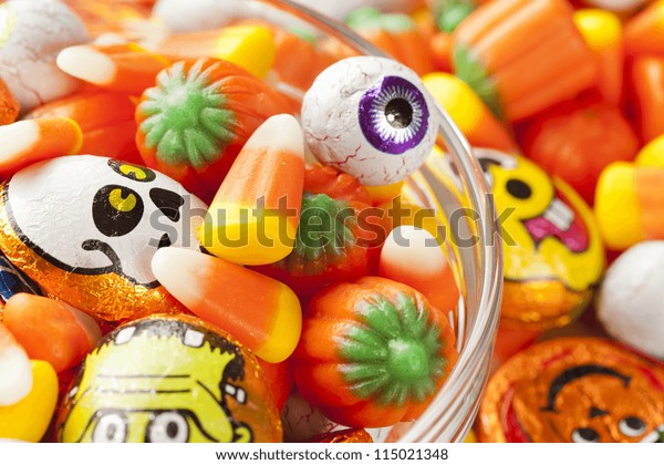 Spooky Orange Halloween Candy Against Background Stock Photo 115021348 ...