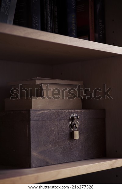 Spooky Wooden Box Lock On Bookshelf Royalty Free Stock Image