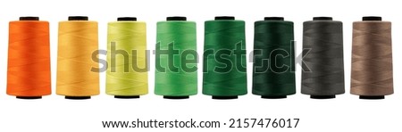Spool of sewing thread, isolated on white background. Colored yarns used by factories in the clothing industry. Threads wound on the spool. Colored reels	