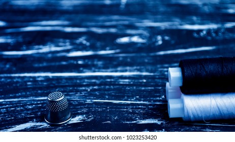 The spool of thread on the table. Thread on a reel for craft. 