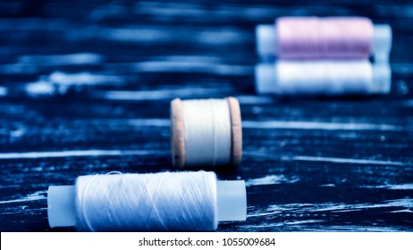 The spool of thread on the table. Thread on a reel for craft. 