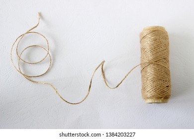spool of thread on white background
