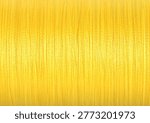 Spool of yellow sewing thread as background, closeup