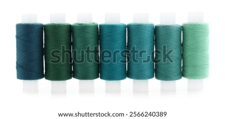 Spools of bright sewing threads isolated on white