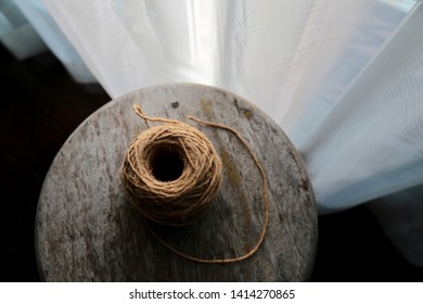 Spools of burlap threads or linen rope coil.