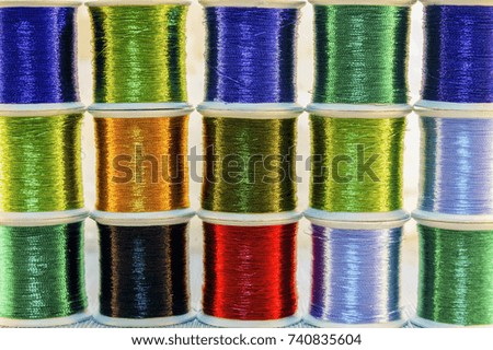 Spools of different sewing threads.