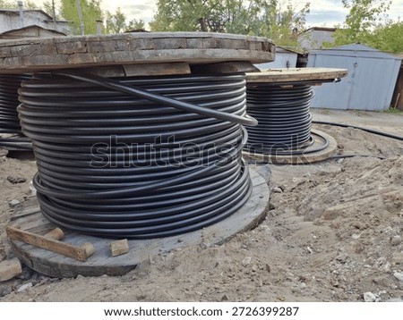 Spools of electrical cable. Cables are unrolled for laying underground