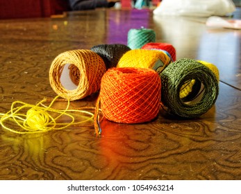 Spools multi-colored threads on the table  